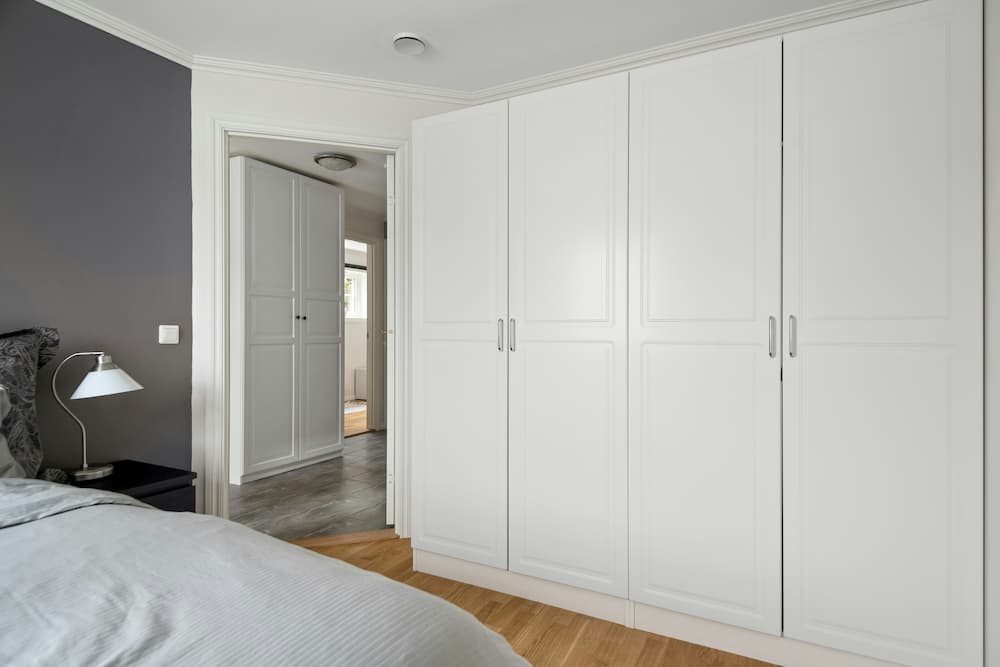Bespoke floor-to-ceiling fitted wardrobe in a North London master bedroom